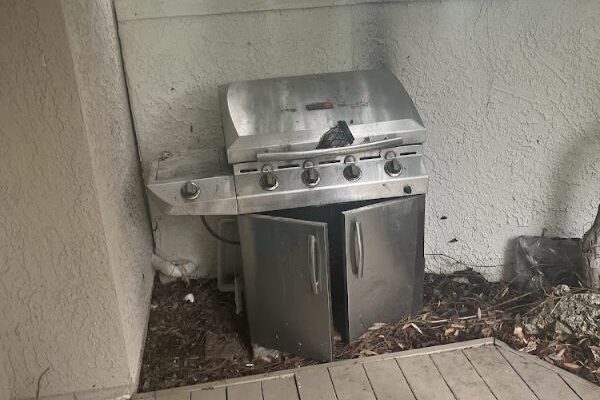 Old outdoor grill ready for removal as part of residential junk removal services in Winter Haven, FL.